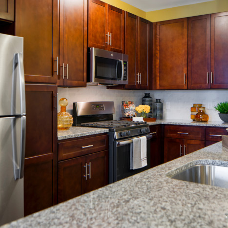 Espresso cabinet kitchen at Creekstone Village apartments in Pasadena, MD