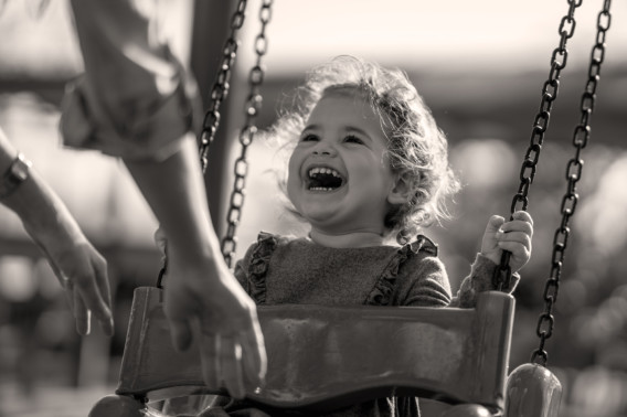 Photo of happy girl on swing | Creekstone Village